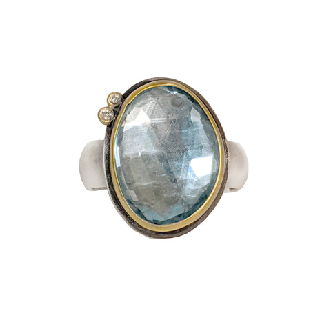 Blue Topaz in 22k gold bezel with 2 diamond dots