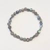 Beaded bracelet with labradorite stones on a white background
