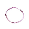 Beaded bracelet with pink and purple stones on a white background