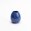 dark blue egg shaped vase with glossy surface