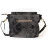Dark gray handbag with gold accents on a white background
