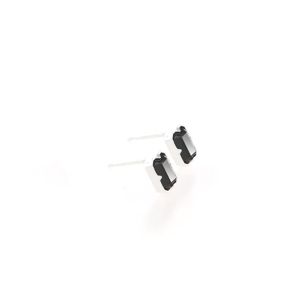 Two black and white earrings on a white background