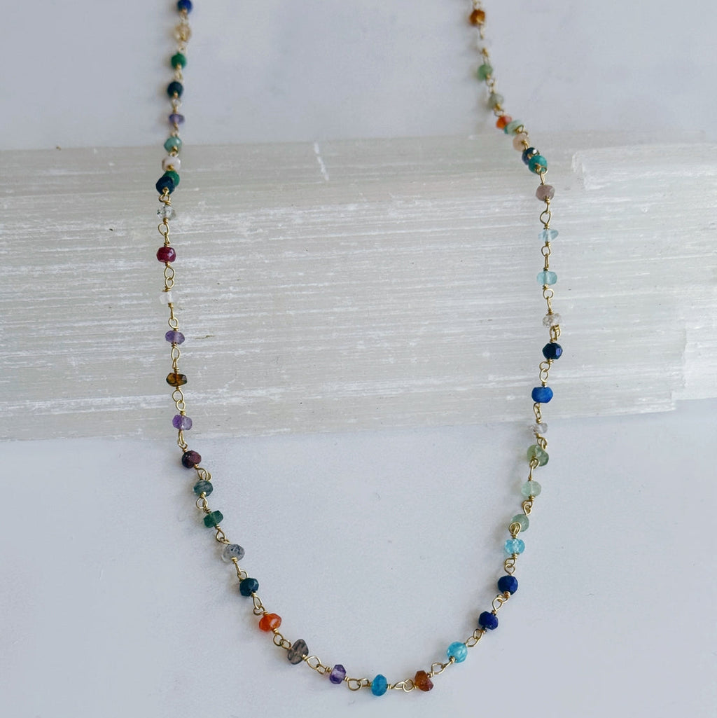 Multicolored beaded necklace on a white background