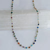 Multicolored beaded necklace on a white background