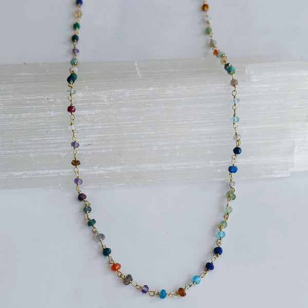 Multicolored beaded necklace on a white background