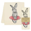 Tea towel with rabbit illustration in a tutu and 'Eric & Christopher' label on a white background