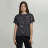Model wearing short sleeve pullover sweater with zippers painted on