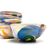 Set of colorful ceramic bowls on a white background