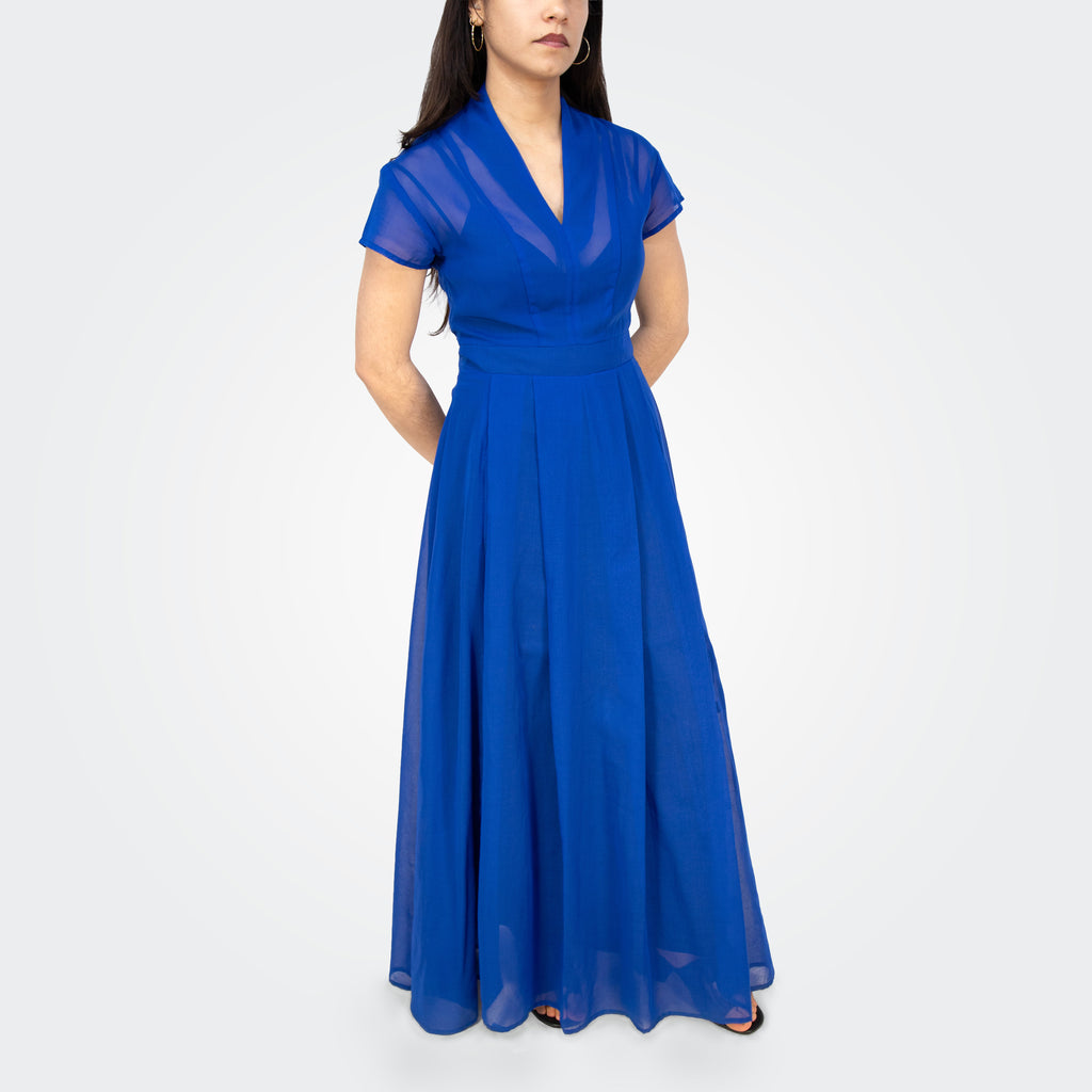 Woman wearing a blue dress on a white background