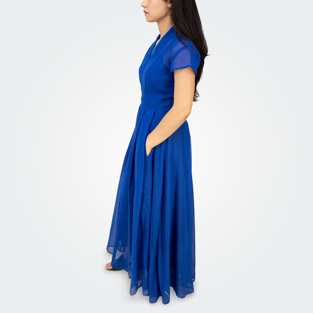 Woman wearing a blue dress on a white background