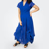 Woman wearing a blue dress on a white background