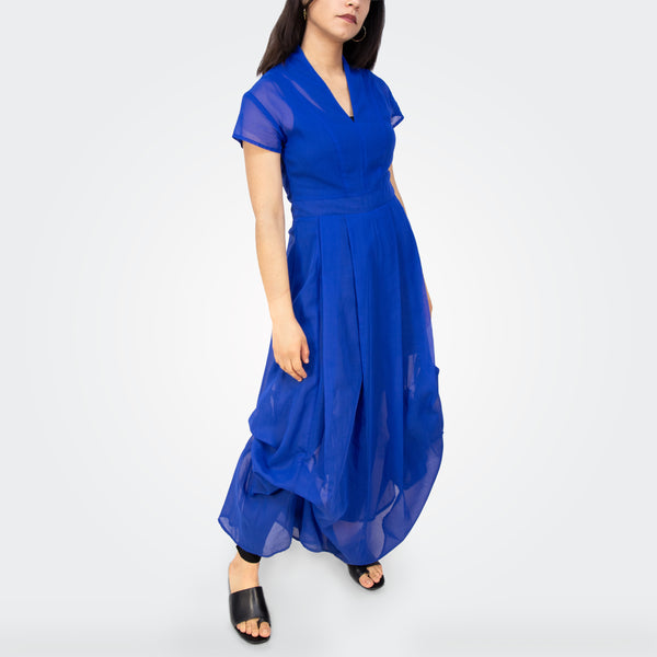 Woman wearing a blue dress on a white background