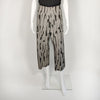 cropped black and grey patterned pants with large pockets on mannequin