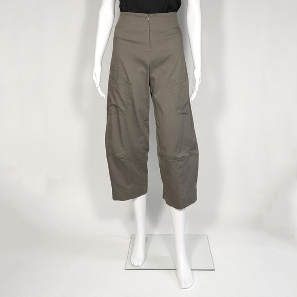Mannequin wearing grey green cargo-like pants with a cropped and barrel-leg legs. It includes a front zipper.