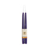 Two purple candles with a label on a white background