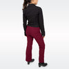 A woman shown from the back wearing a black long-sleeve collared shirt and burgundy straight-leg pants, paired with black heeled shoes, against a light gray studio background.