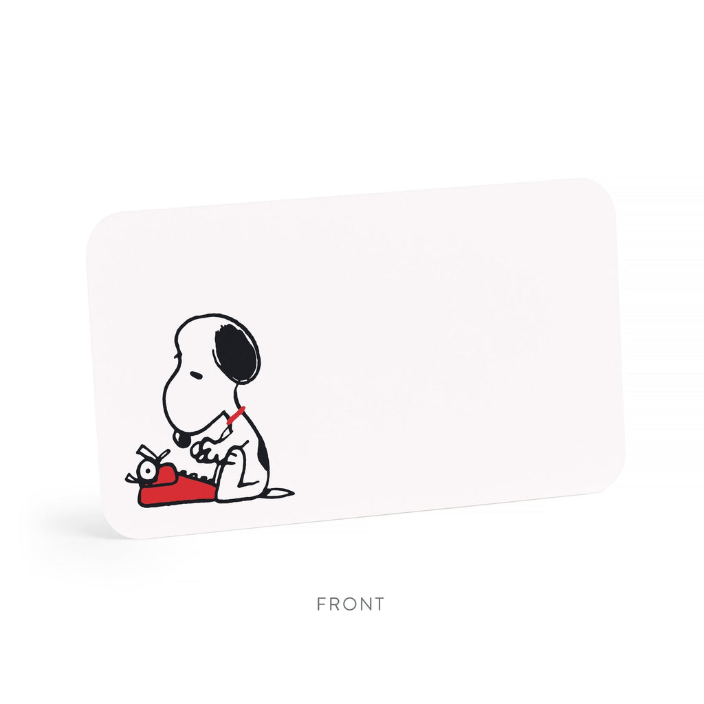 A white rectangular product with rounded corners, shown at a slight angle on a white background. The front features a small black-and-white cartoon dog sitting on a red object.