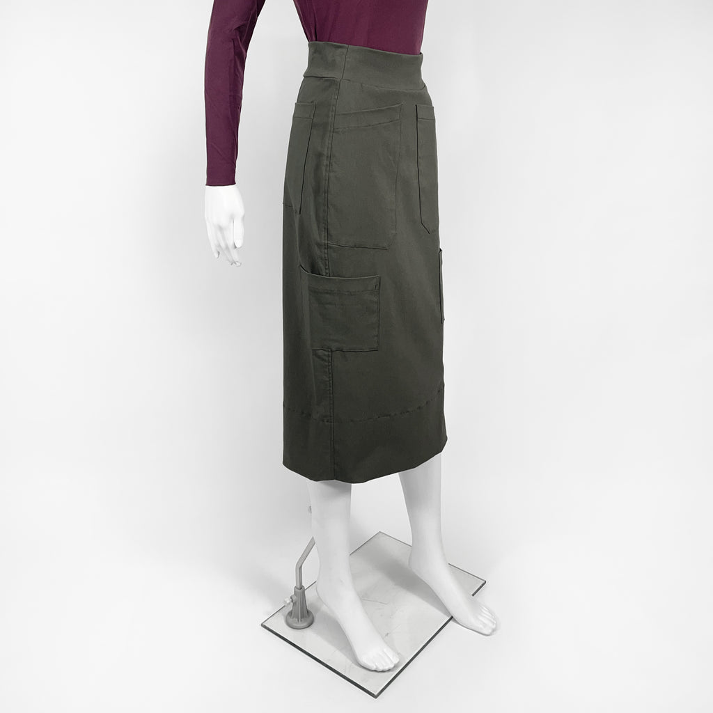 Green skirt on a mannequin against a white background