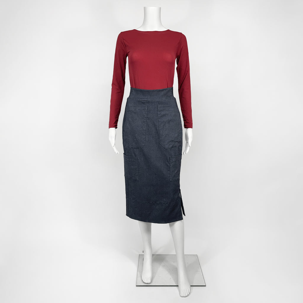 Mannequin wearing a red top and black skirt on a white background