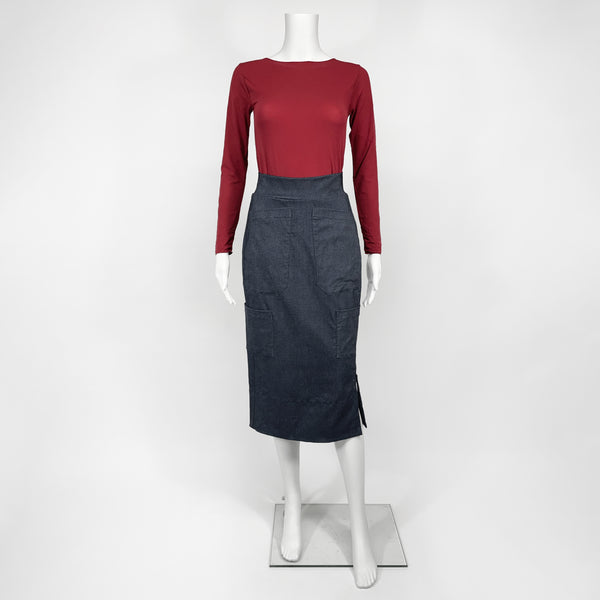 Mannequin wearing a red top and black skirt on a white background
