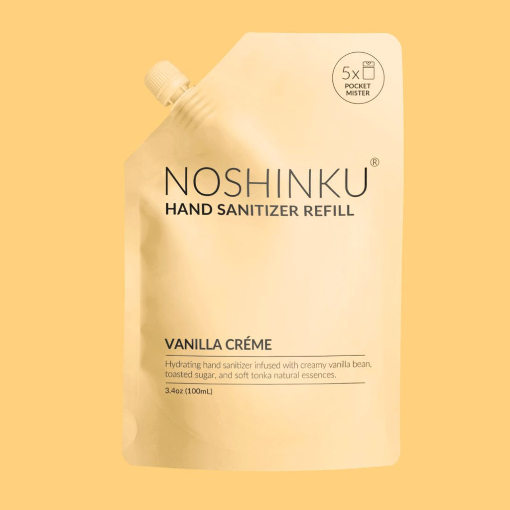 Noshinku Vanilla Crème hand sanitizer refill pouch on a solid pale yellow background.