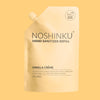 Noshinku Vanilla Crème hand sanitizer refill pouch on a solid pale yellow background.