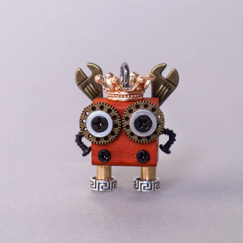 Small mechanical creature with a crown on a light gray background