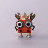 Small mechanical creature with a crown on a light gray background