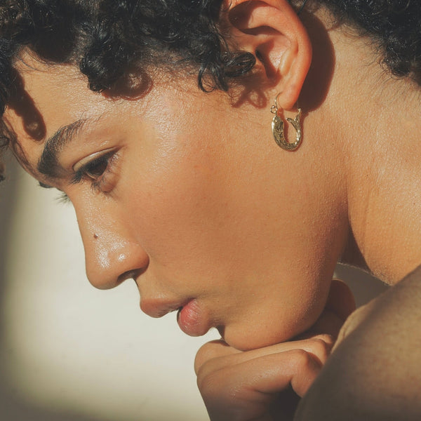 Profile of woman with earring