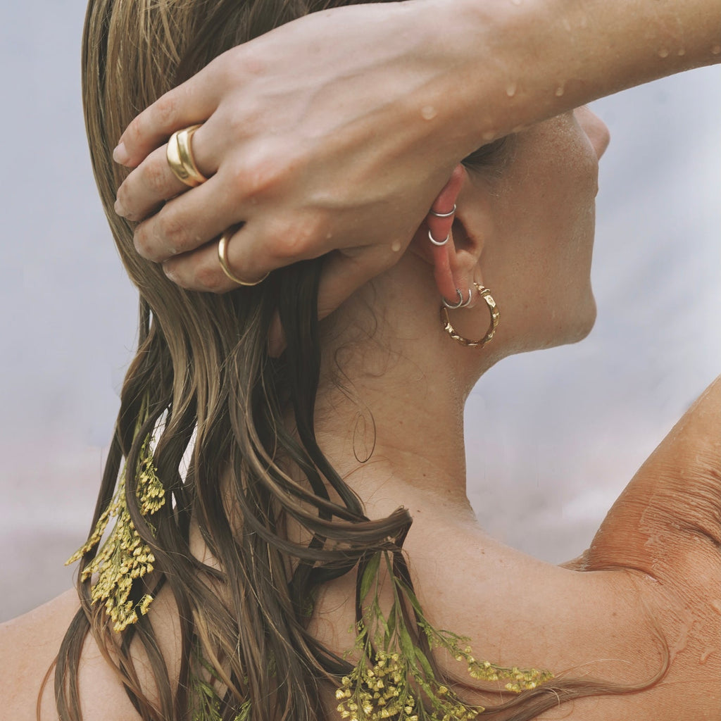 back of girls head with earring