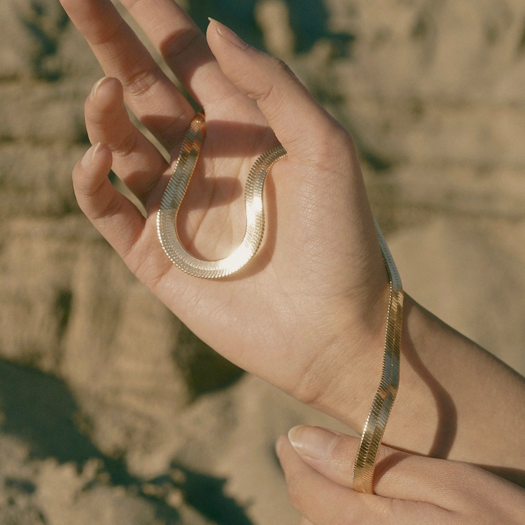 Necklace wrapped around hand