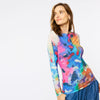 woman wearing long sleeve shirt with brushed bright colors design