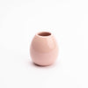 light pink egg shaped vase with glossy surface