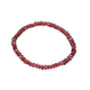 Beaded bracelet with red beads on a white background