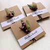 Three brown paper cards with floral decorations and 'thanks a bunch!' text on white background